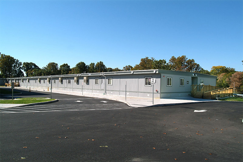 A parking lot surrounds a modular classroom building in Pedricktown, NJ