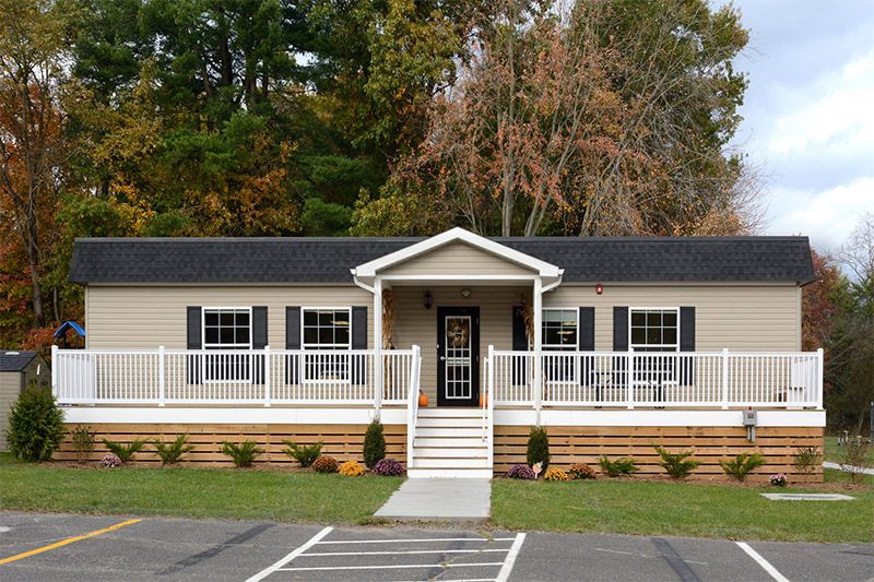 Modular classroom mobile home with a porch and deck, located in Pedricktown, NJ