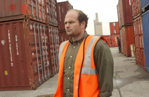 Port worker handling operations near containers in Pedricktown, NJ